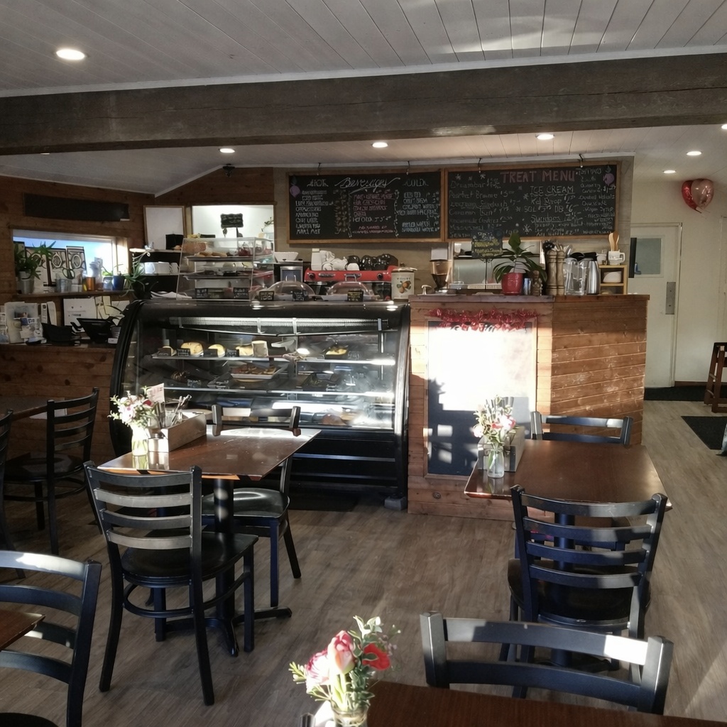 cozy cafe interior with bakery display directory Vancouver: Neighbourhood Food Tour cozy cafe interior with bakery display directory