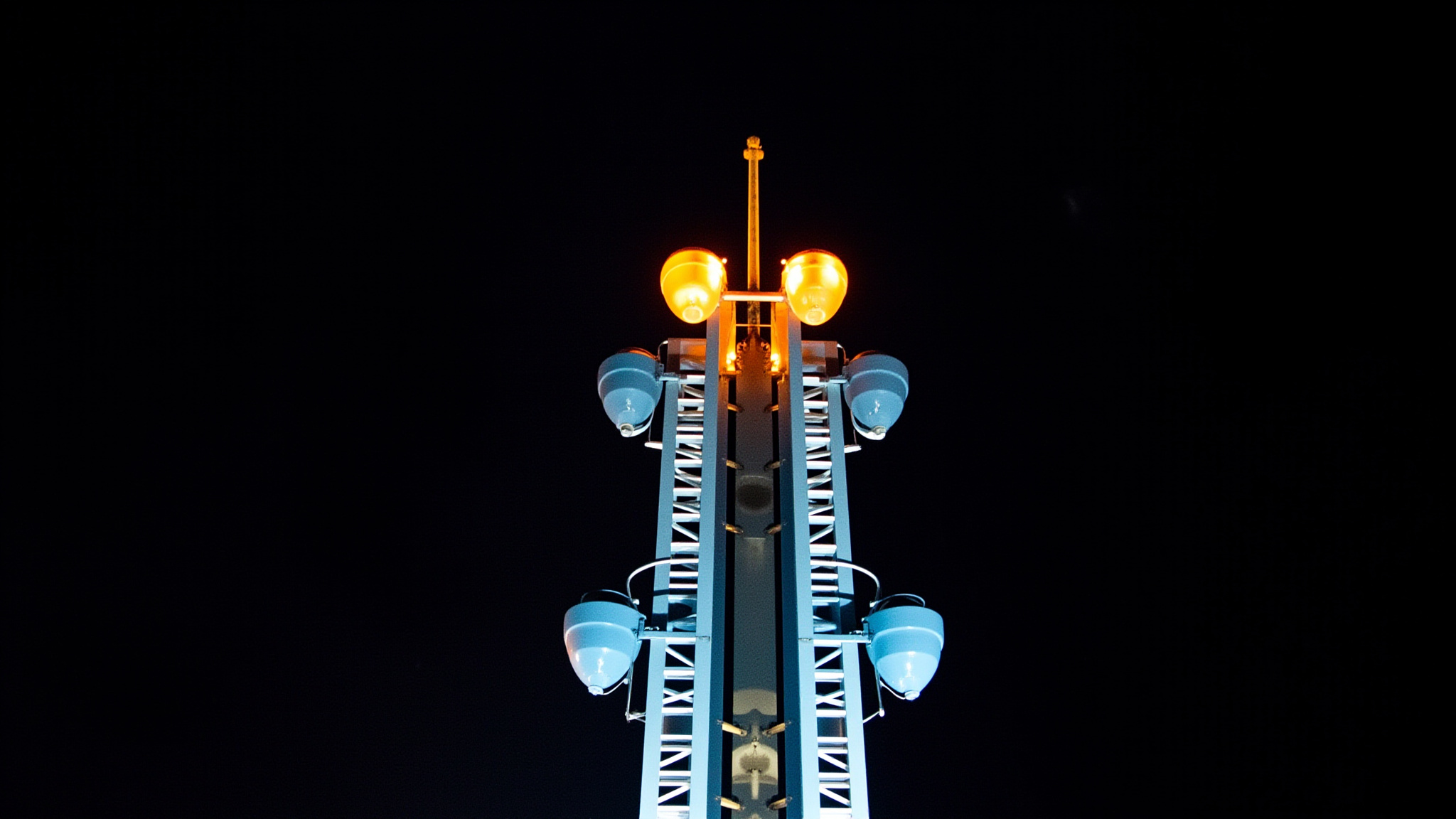 pne featured hellevator vancouver The PNE in Vancouver: What to Expect in 2026 The top of a PNE Playland thrill ride glowing at night in Vancouver