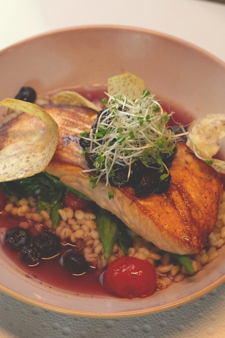 Salmon Berry Sinigang at Halina: seared coho salmon over pearl barley in a blueberry sinigang broth